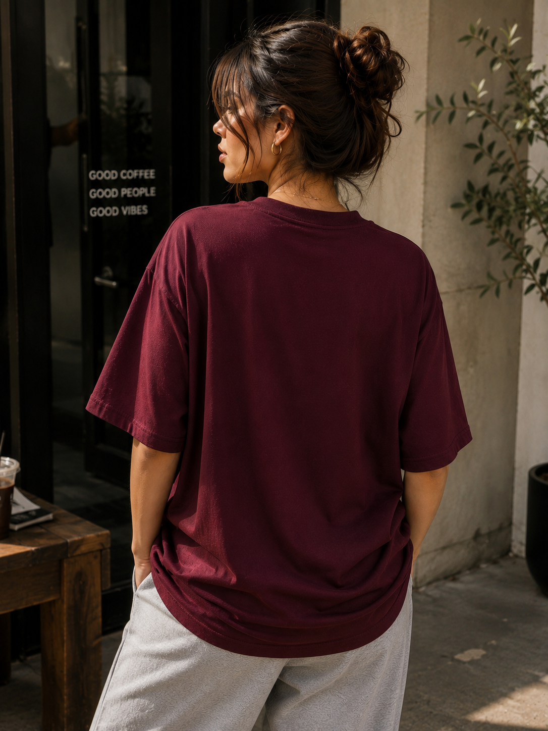 Back view of model wearing Queenly Vogue Leopard burgundy tee with plain back