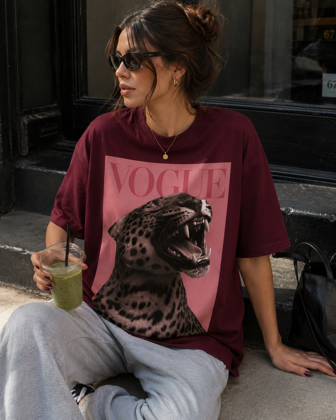 Front view of model wearing Queenly Vogue Leopard burgundy graphic tee