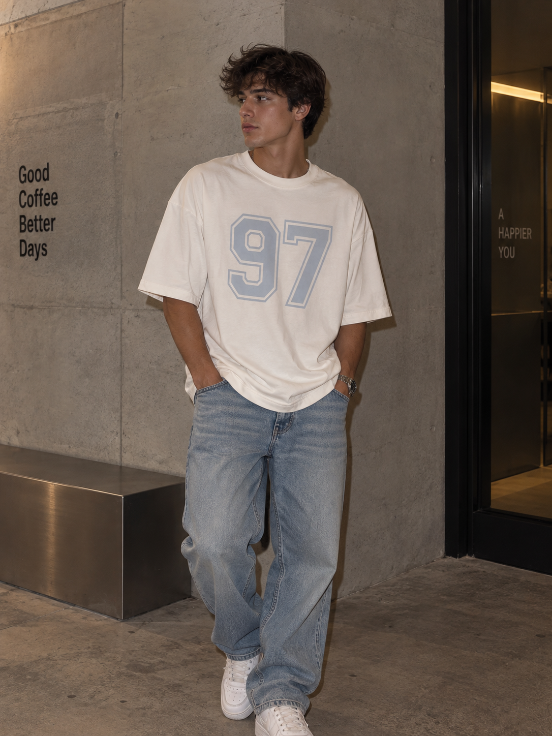 White 97 oversized graphic tee on a male model