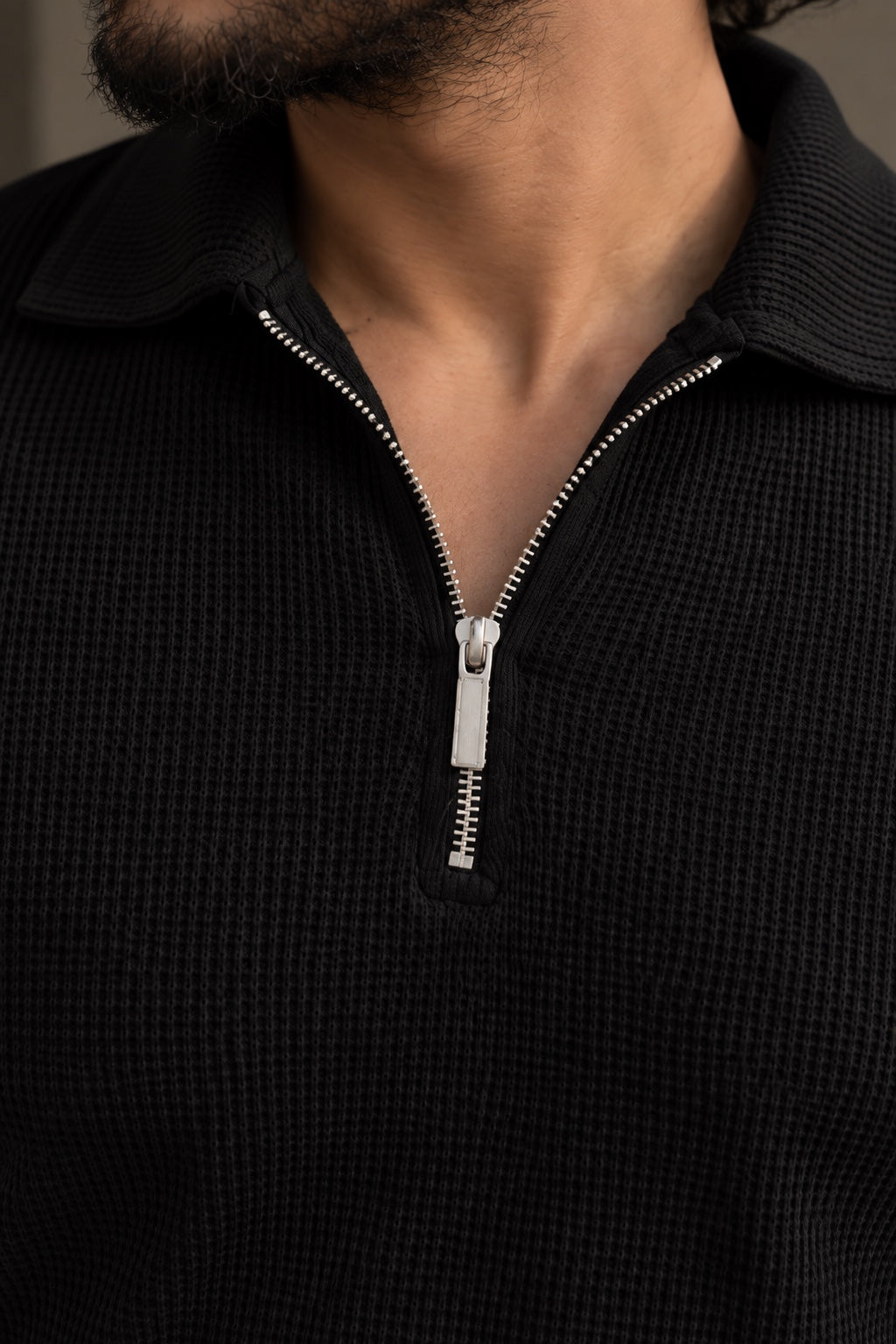 Black Zip Polo zipper and fabric close-up